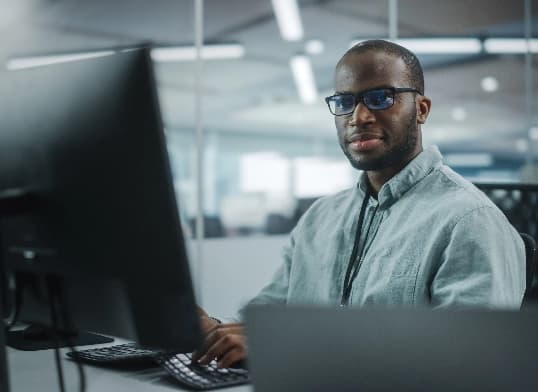 employee looking at monitor